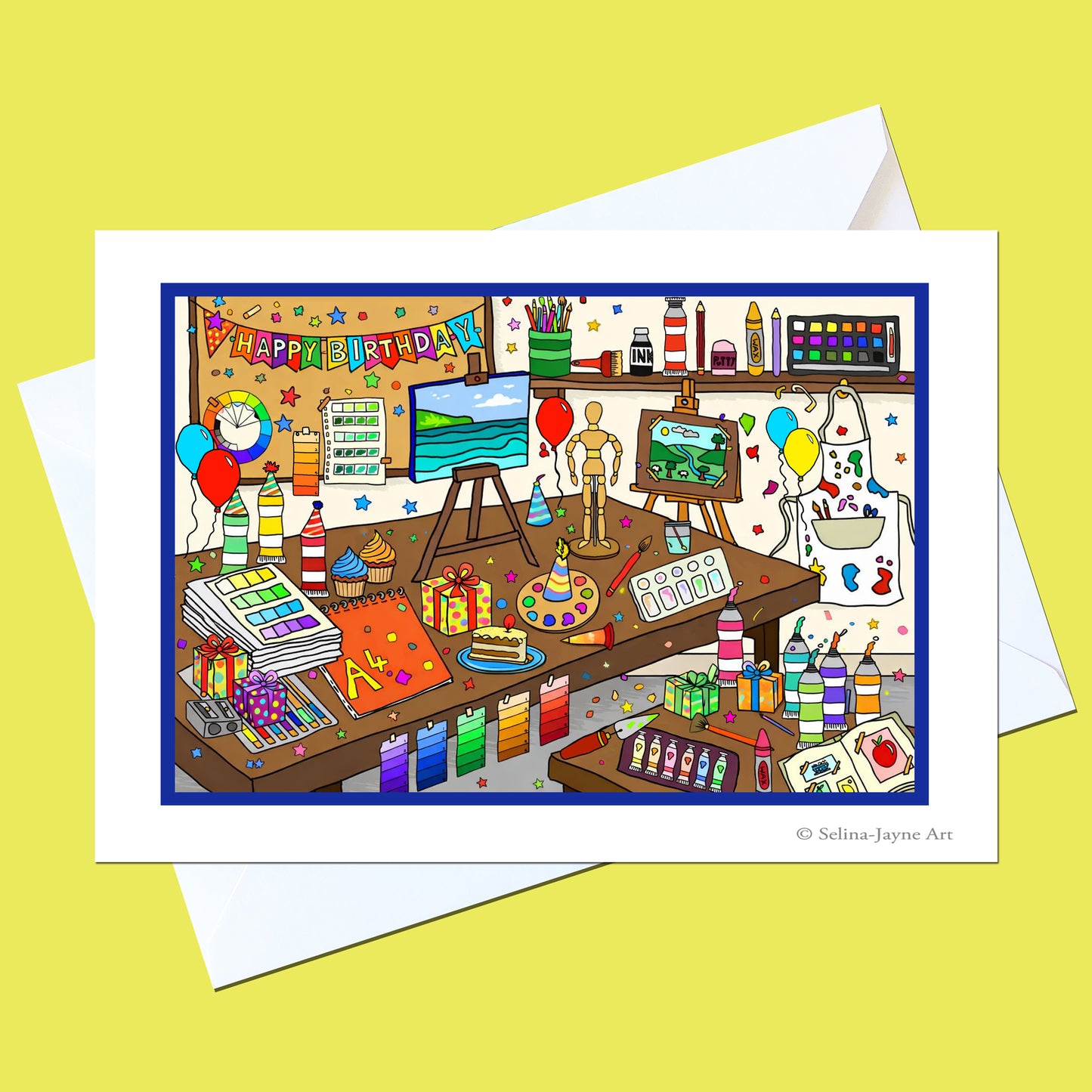 A square art print card featuring a colorful cartoon illustration of a creative artist's studio, displayed on top of a white envelope against a solid pale yellow background. The print is signed '© Selina Jayne Art' in the bottom right corner.