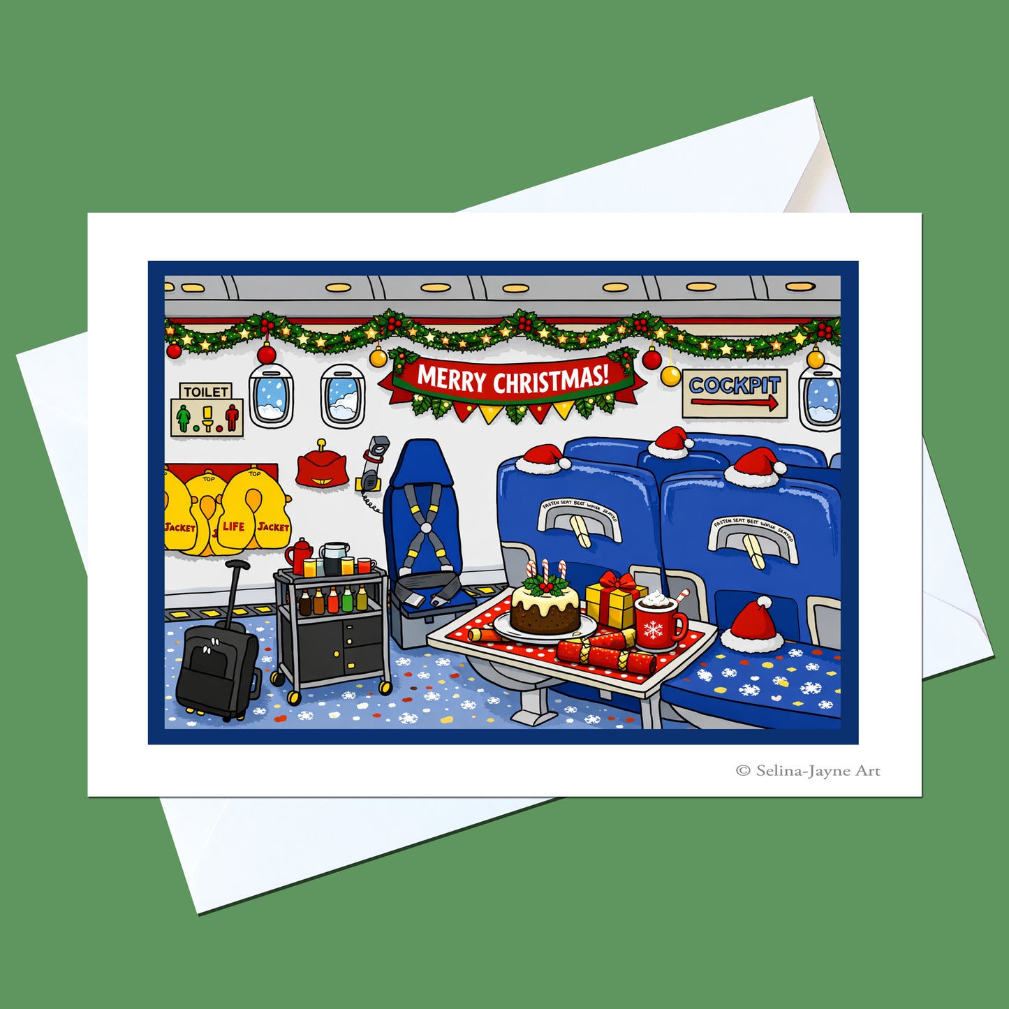 A Christmas-themed illustrated greeting card showing a train compartment with blue seats, holiday garlands, a cake on the table, and a 'Merry Christmas!' banner, displayed with white envelopes on a solid green background.