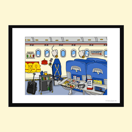 A framed cartoon illustration of an airplane cabin interior, shown against a pale beige background. The artwork features blue seats, overhead bins, a luggage cart, a suitcase, and small travel accessories, with a black frame and white mat around it.