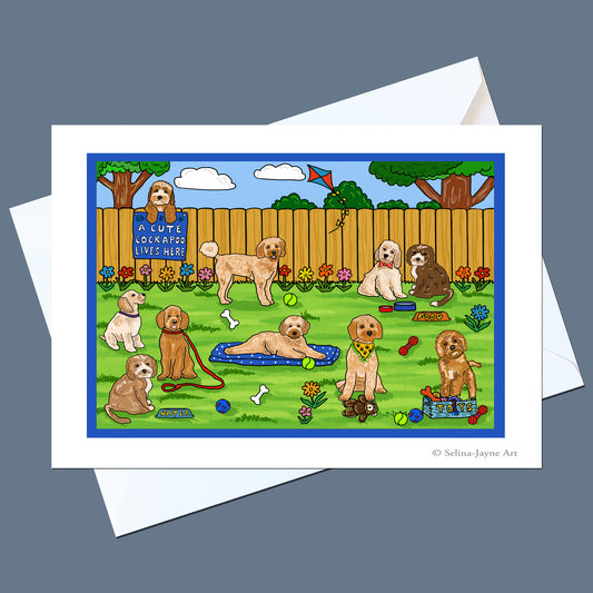 Cockapoo greeting card by Selina-Jayne Art, showing a colourful illustrated scene of Cockapoos, displayed with a white envelope