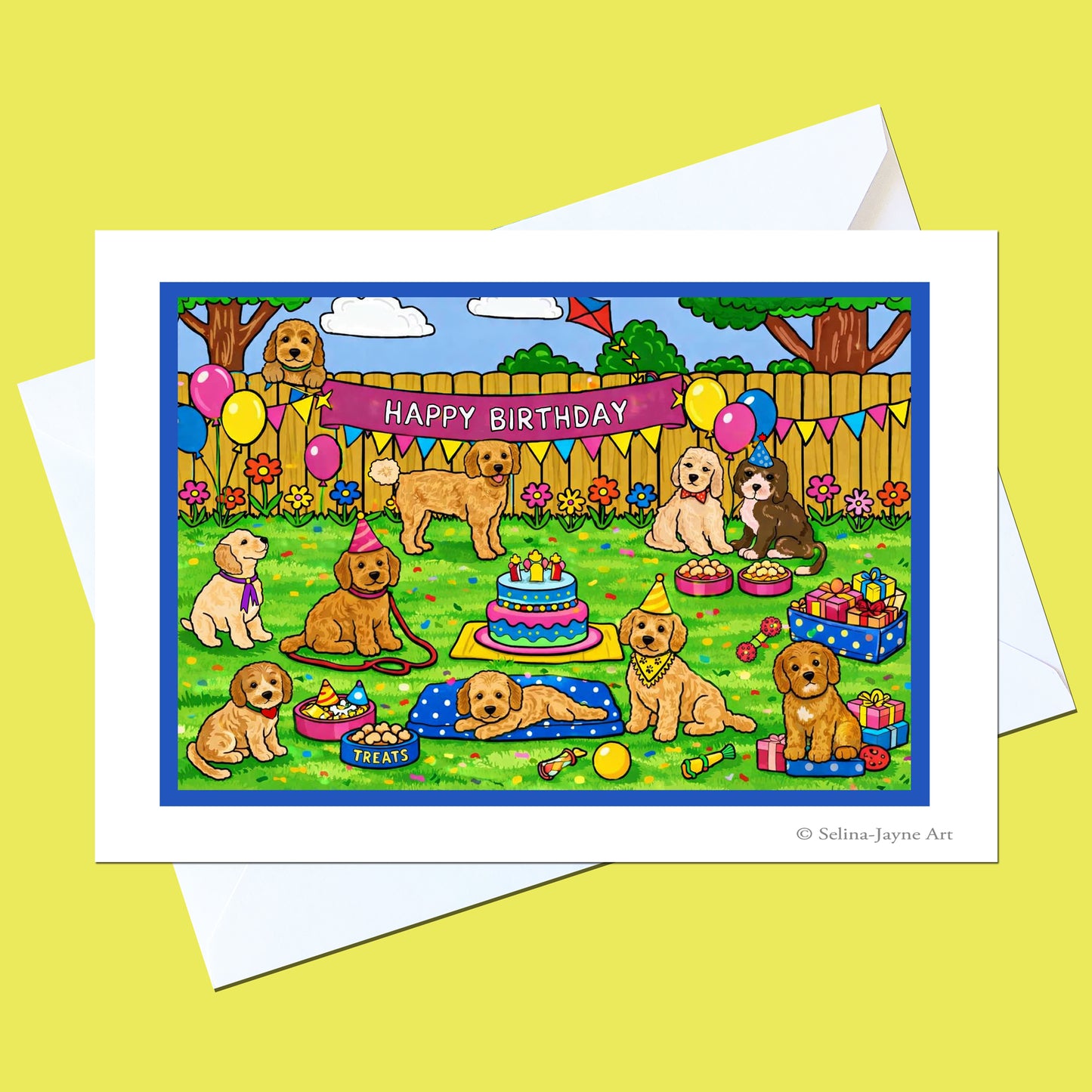Cockapoo birthday card by Selina-Jayne Art with a festive illustrated scene of Cockapoos celebrating, shown with a white envelope on a yellow background