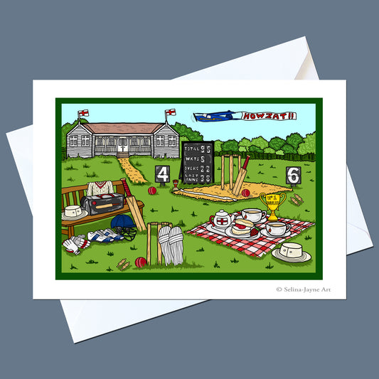 A white greeting card with a colorful cartoon illustration of a cricket match scene, shown with white envelopes on a dark gray background. The illustration includes a cricket pitch, scoreboard, bench, tea set, and a building labeled 'HOWZATH'.