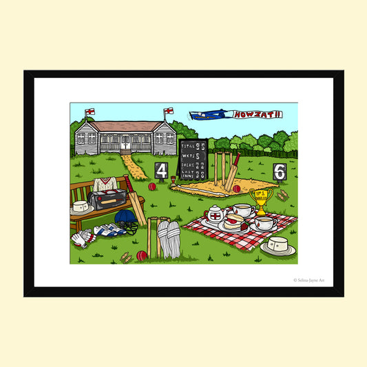 A framed cartoon art print depicting a cricket match scene with a scoreboard, bats, balls, a bench, and a tea-time setup on the grass, shown against a pale yellow background.