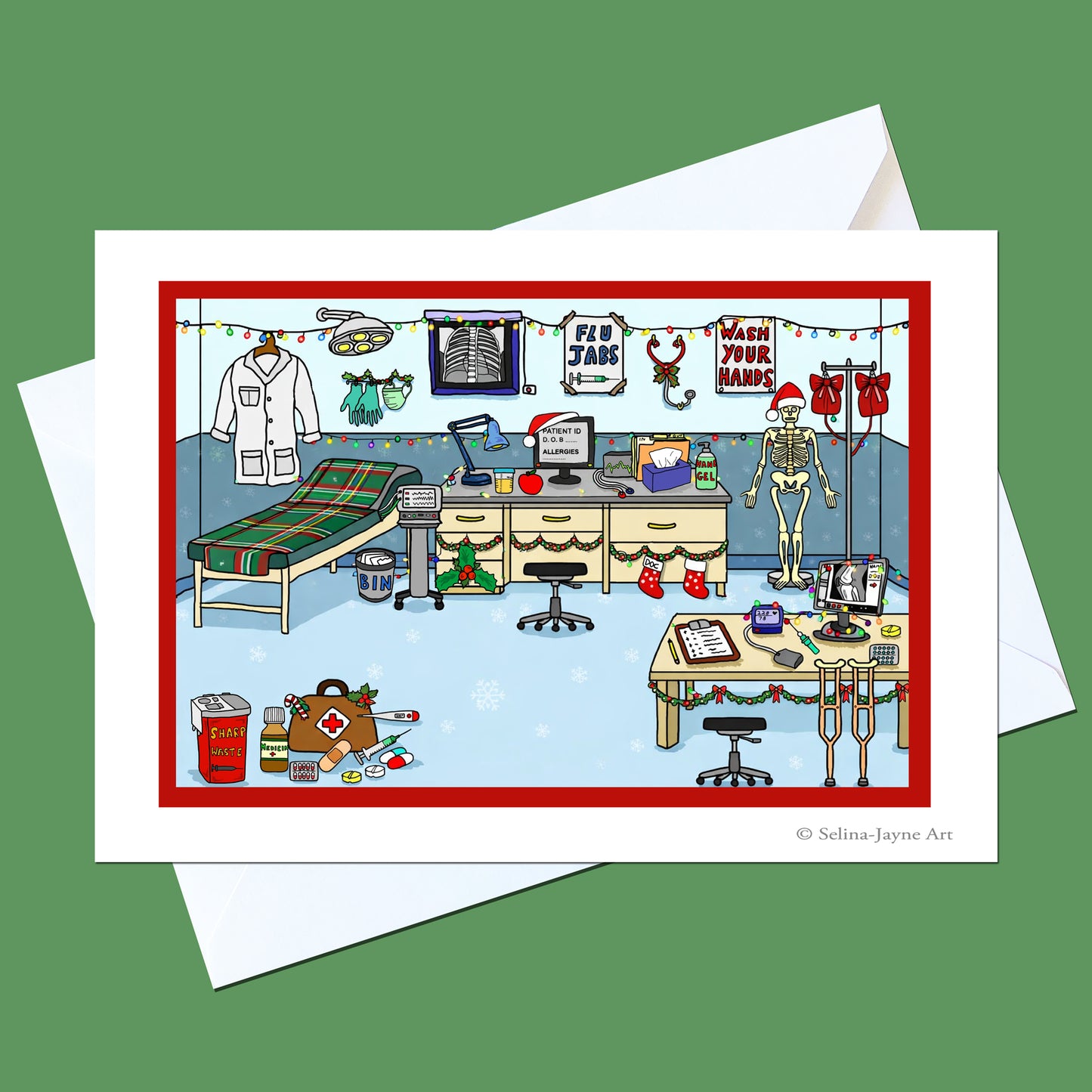 A white greeting card with a red border and a whimsical medical-themed Christmas illustration, shown with white envelopes on a solid green background. The illustration features a doctor's office decorated with holiday lights, a skeleton, and medical supplies with the text 'Merry Your Mings'.