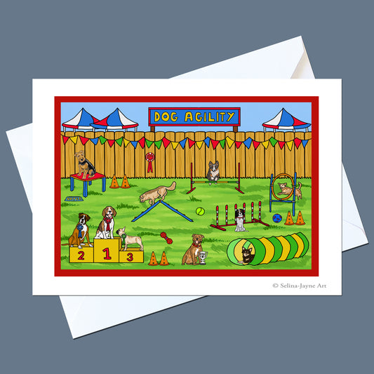 A square art print or greeting card featuring a colorful cartoon dog agility race scene, shown with white envelopes on a slate blue background. The print has a red border and the words 'DOG AGILITY' at the top.