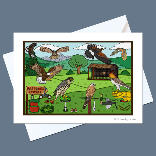 A printed art card or postcard featuring a colorful illustrated falconry scene with multiple birds, a coop, trees, and accessories, shown on top of white envelopes against a muted blue-gray background. Small text in the lower right reads 'Selina Jayne Art'.