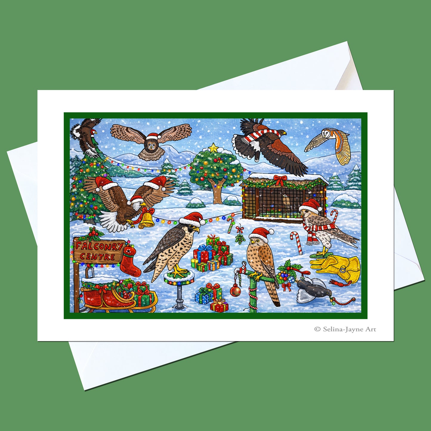 A Christmas-themed art print featuring various birds in a snowy winter landscape with holiday decorations, shown with a white envelope on a solid green background.
