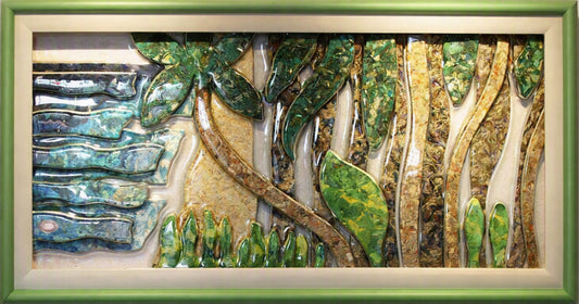 A framed  Trapunto At Glass piece depicting a tropical forest scene with textured green leaves, brown tree trunks, and blue-green water elements, enclosed in a light green frame.