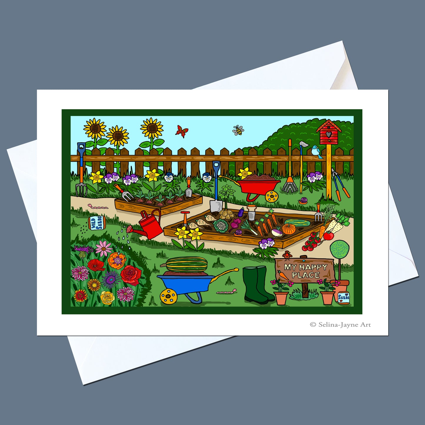 A square art print or greeting card featuring a colorful illustrated garden scene with flowers, raised beds, gardening tools, a wheelbarrow, and a sign reading 'My Happy Garden,' shown with white envelopes on a gray background.
