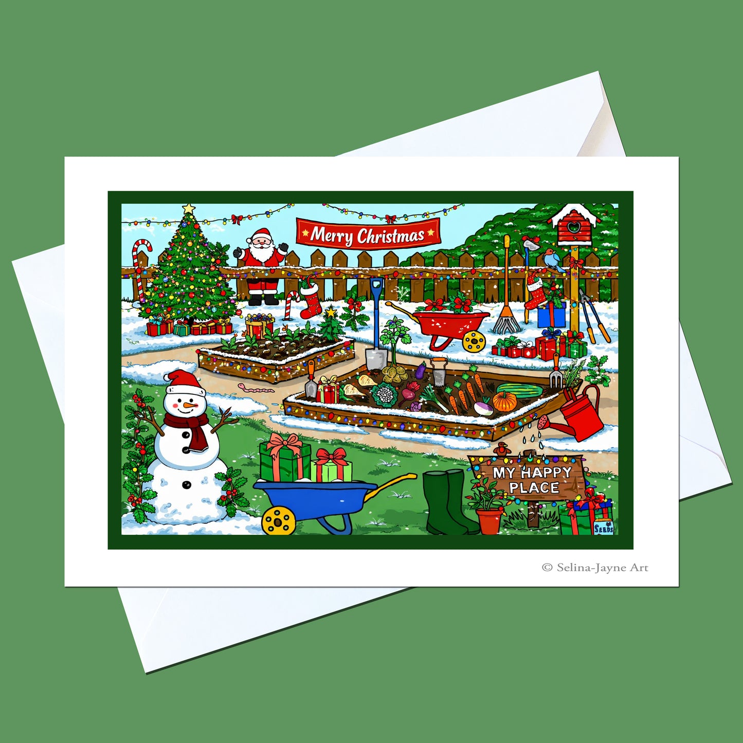 A Christmas-themed garden art print or card shown with white envelopes on a solid green background. The illustration features Santa Claus, a snowman, a decorated Christmas tree, gardening tools, and a sign that reads 'My Happy Place' and 'Merry Christmas'.