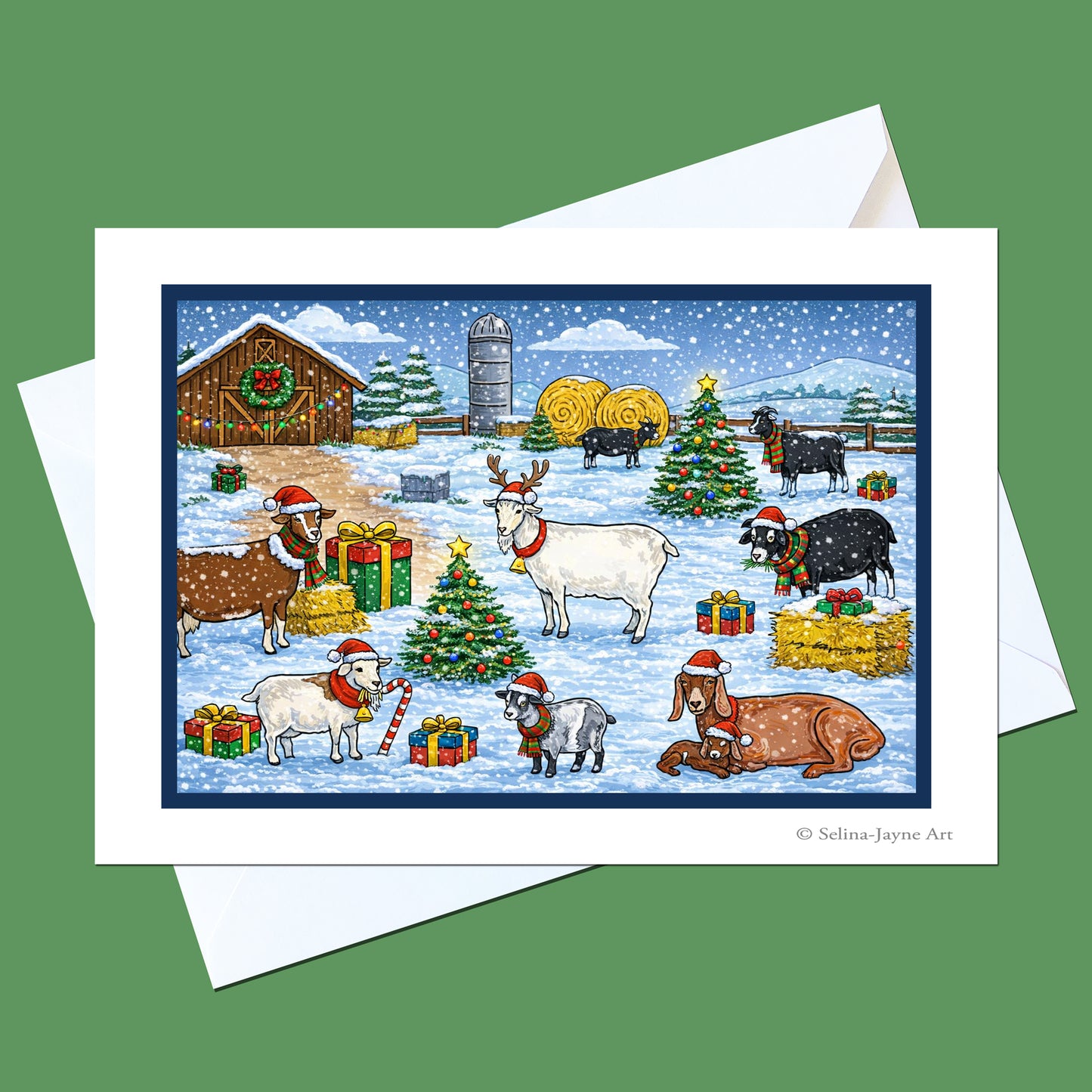 A holiday-themed art print or greeting card featuring farm animals in a snowy Christmas scene, shown with a white envelope on a solid green background. The artwork includes sheep, goats, a cow, a reindeer, a barn, hay bales, and Christmas trees with gifts.