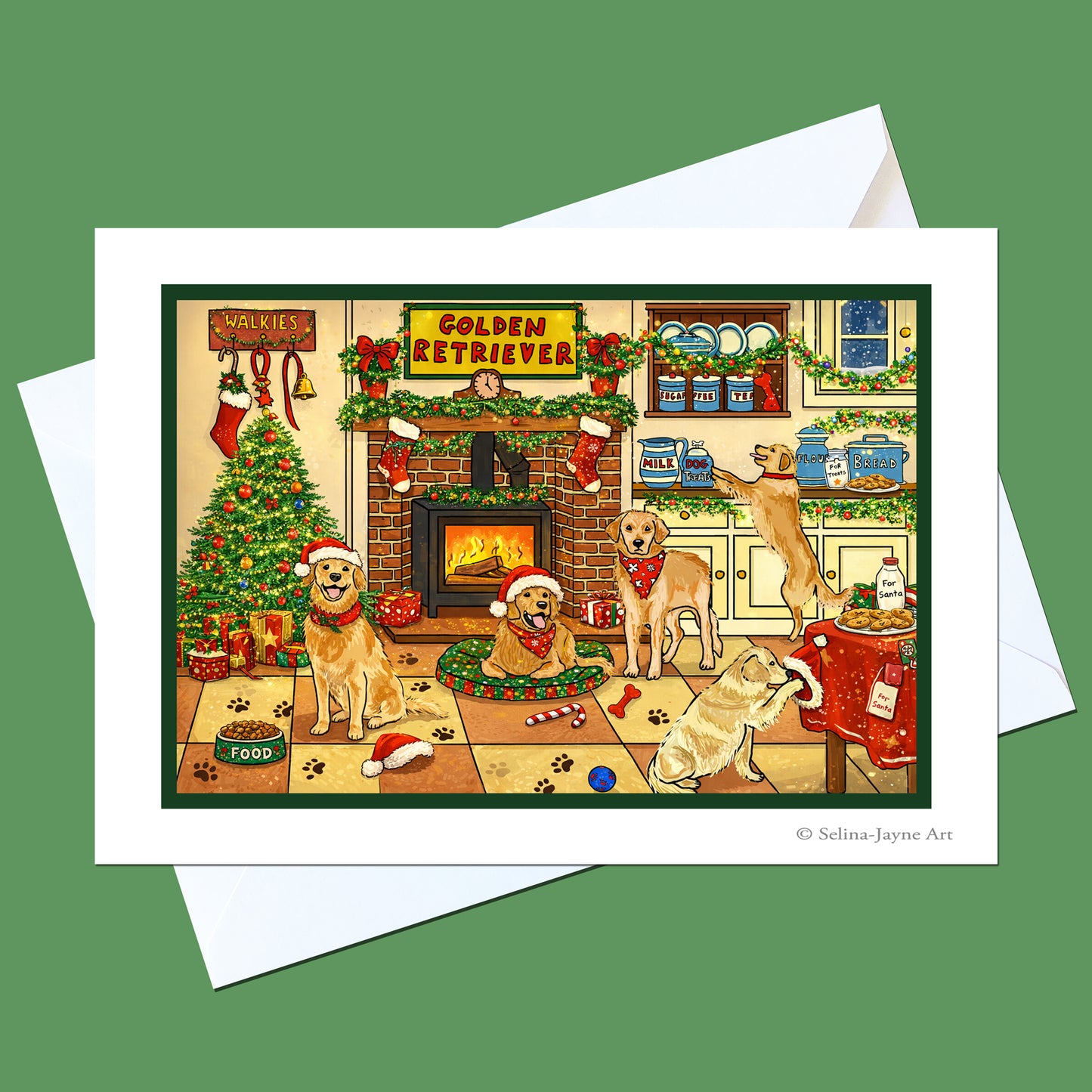 A Christmas-themed art print featuring golden retriever dogs in a cozy living room with a fireplace, decorated tree, stockings, and holiday garlands, shown with a white envelope on a green background.