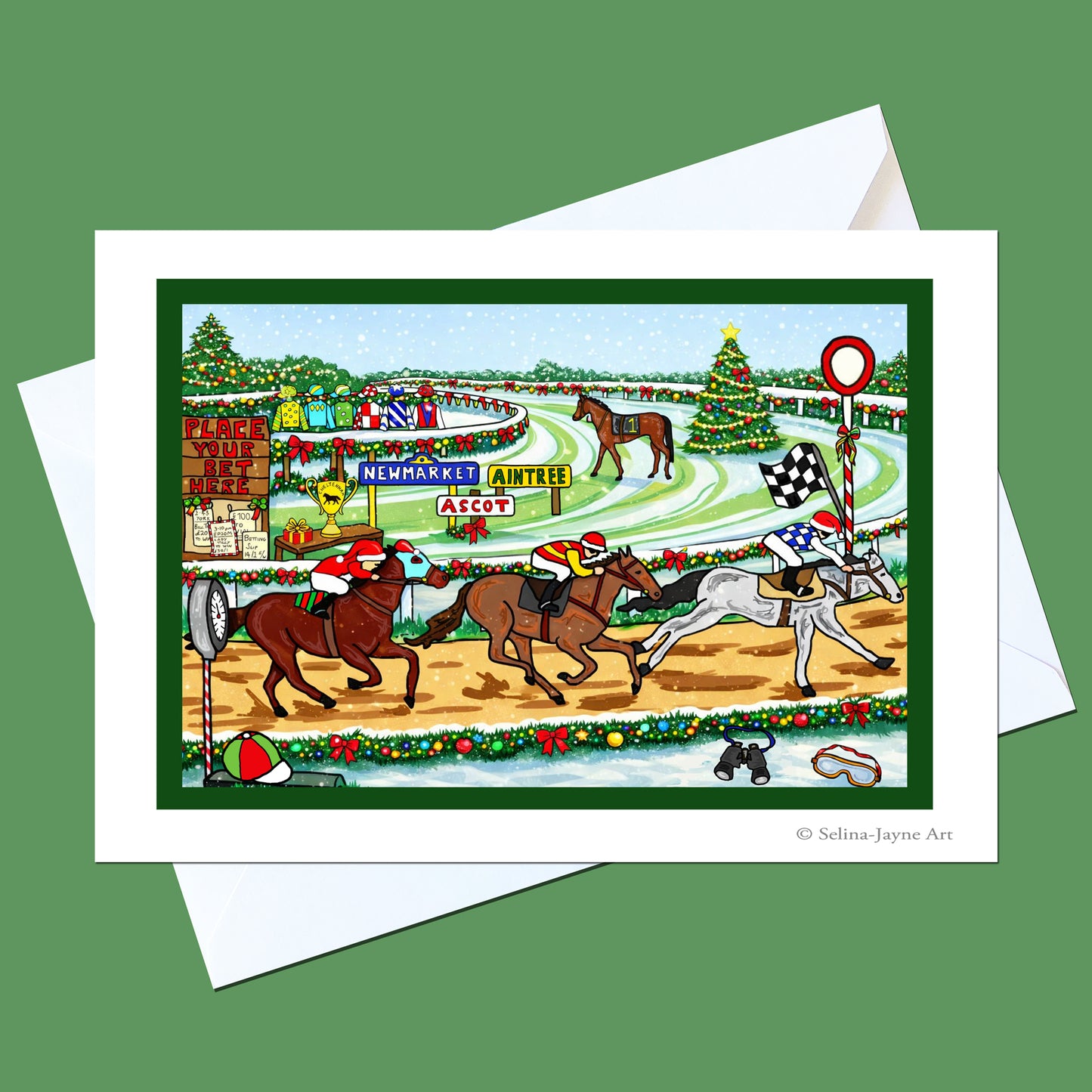 A holiday-themed horse racing art print on a white card, displayed with a white envelope on a solid green background. The illustration features horses racing on a decorated racetrack with Christmas trees, ornaments, and a jockey.