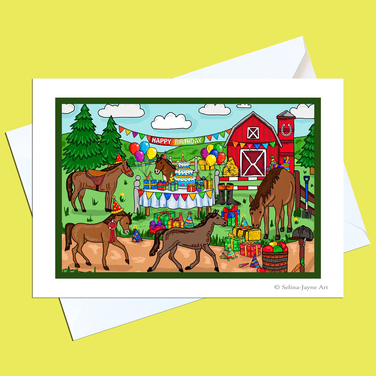 A greeting card featuring a colorful cartoon barnyard birthday scene with horses, a red barn, balloons, gifts, and a party table, shown with white envelopes on a pale yellow background.