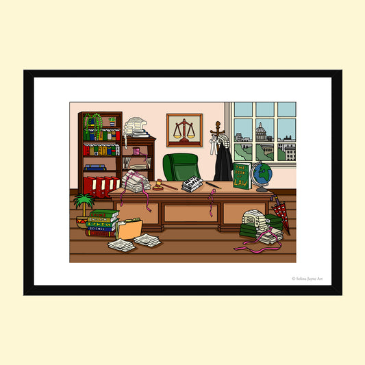 A framed art print featuring a cartoon illustration of a messy law office with a desk, books, chair, window, and scattered papers, shown against a pale cream background.