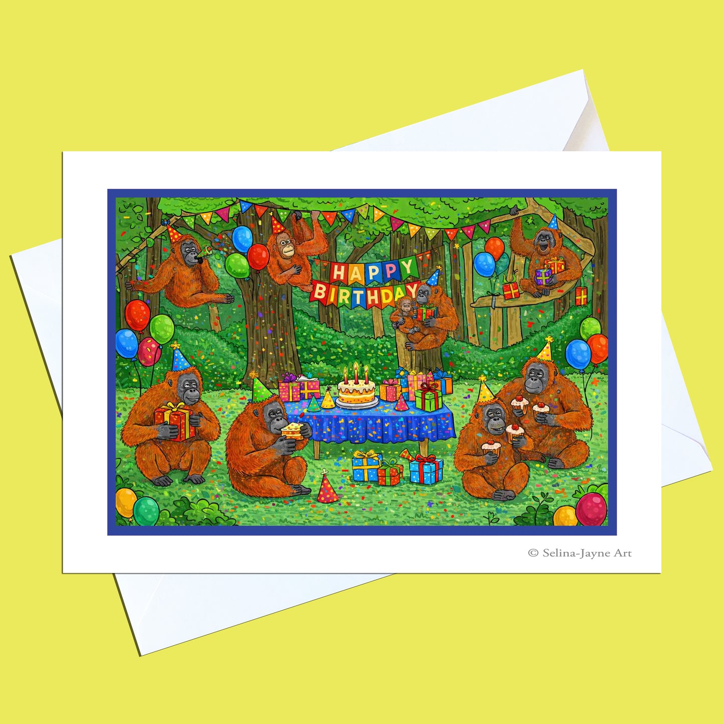 A square greeting card with a white border and matching white envelope, featuring a colorful illustration of orangutans celebrating a birthday in a forest. The card is displayed on a bright yellow background.