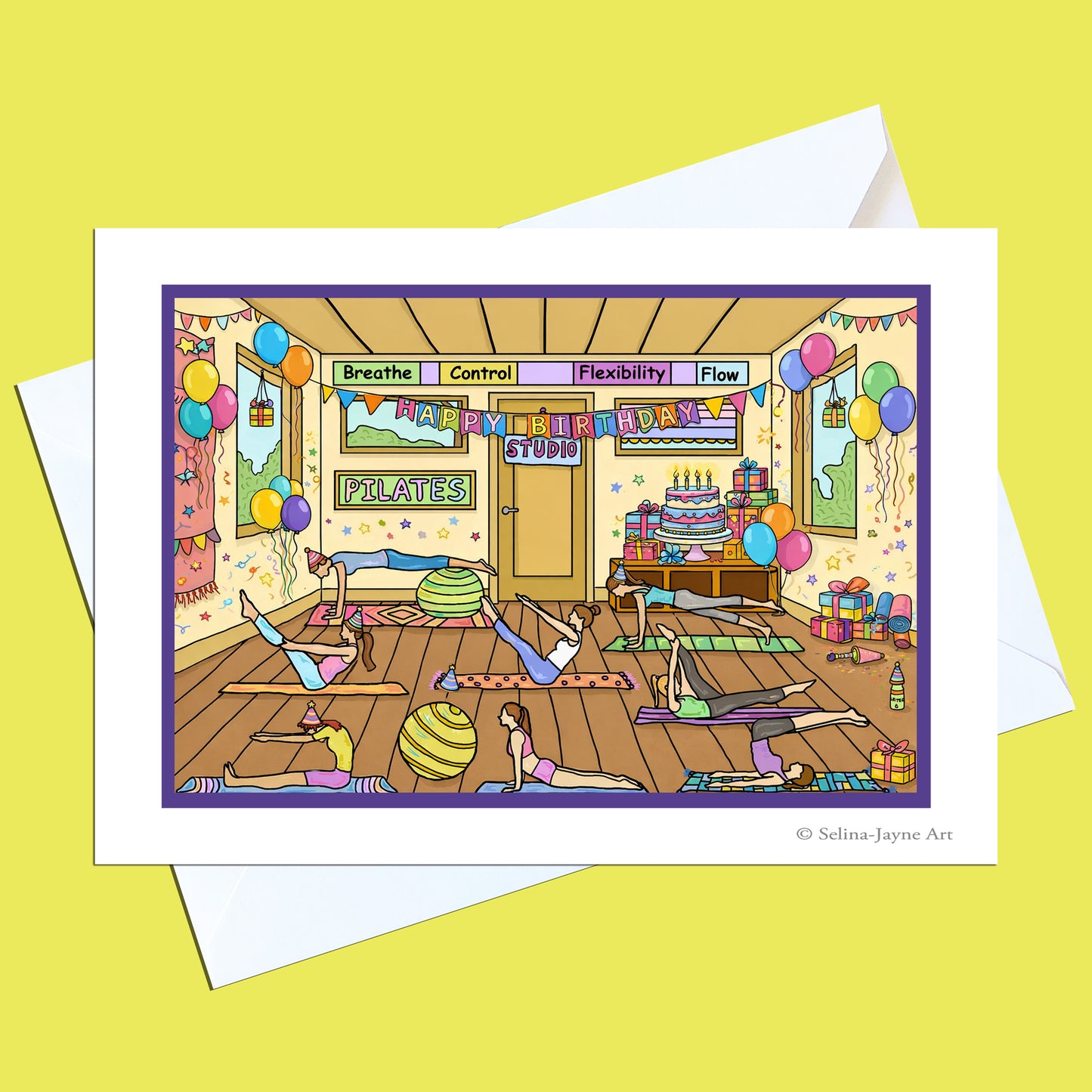 A printed art card featuring a colorful illustrated yoga studio scene with people practicing poses, set against a yellow background with white envelopes behind it.