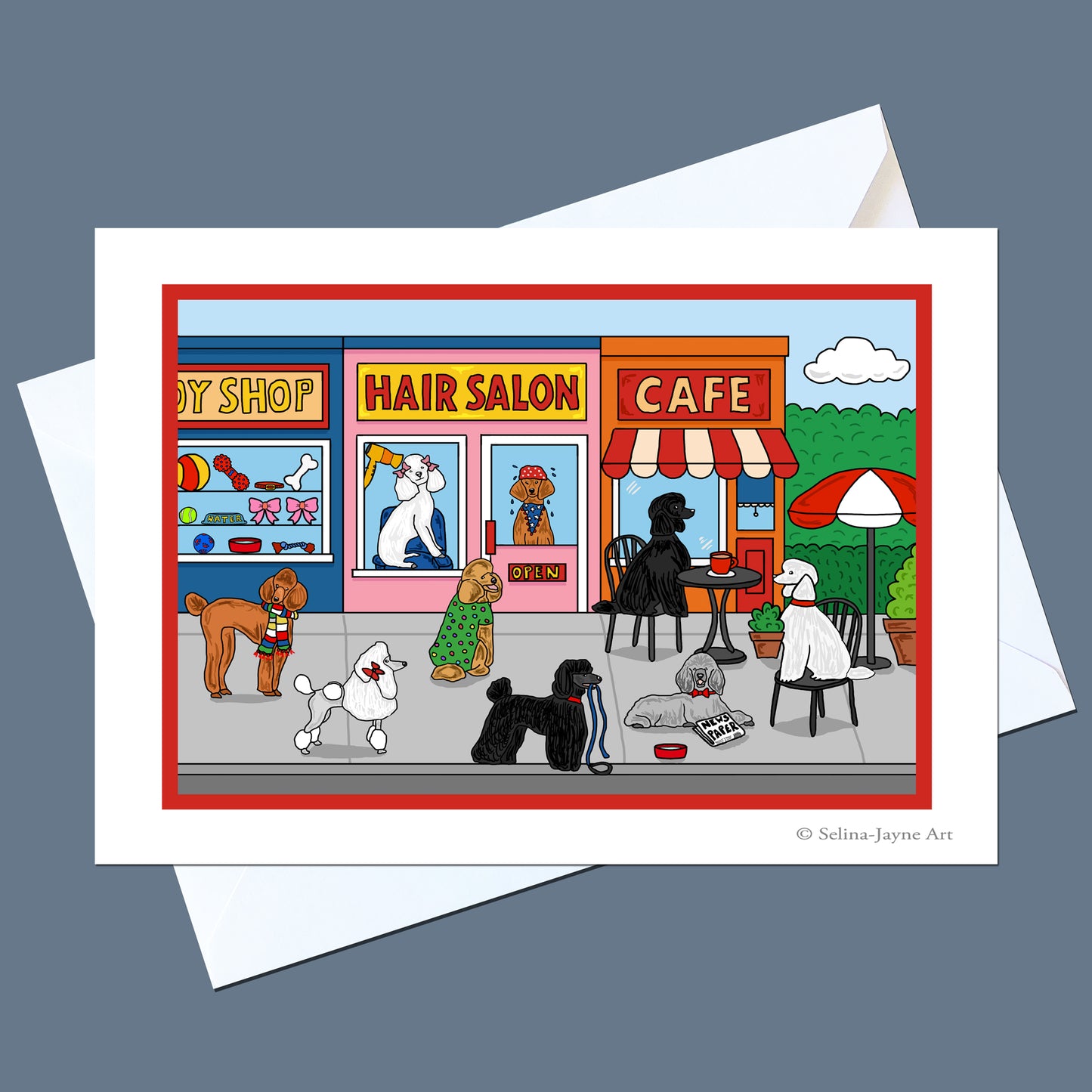 A printed art card featuring a colorful cartoon storefront scene with dogs at a hair salon and cafe, shown with white envelopes on a muted blue-gray background. The card includes the visible text '© Selina Jayne Art' in the lower right corner.