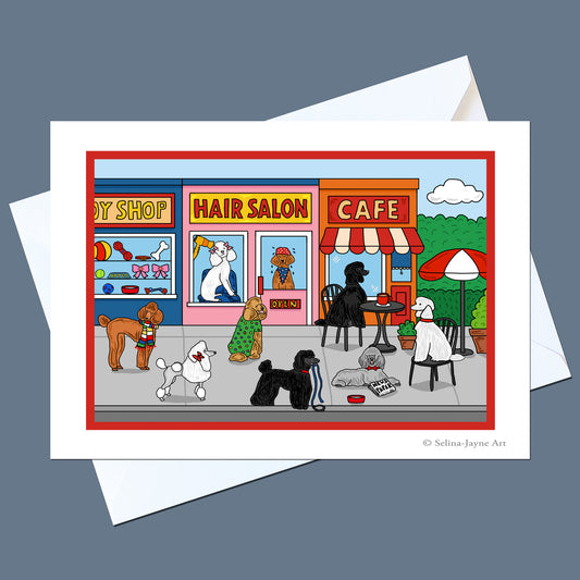 A printed art card featuring a colorful cartoon storefront scene with dogs at a hair salon and cafe, shown with white envelopes on a muted blue-gray background. The card includes the visible text '© Selina Jayne Art' in the lower right corner.