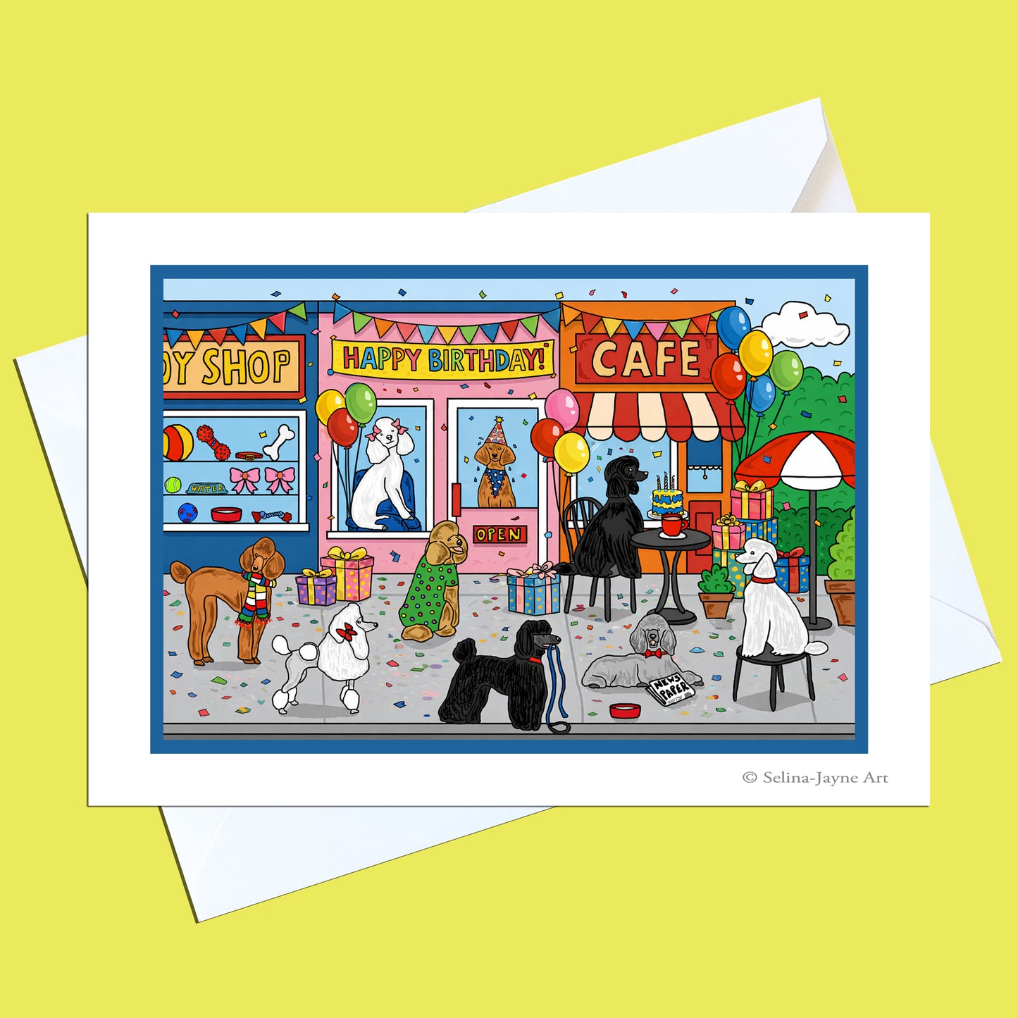 A square art print or greeting card shown with white envelopes on a pale yellow background. The card features a colorful cartoon storefront scene with dogs, balloons, a cafe, and a shop front, plus the text 'Happy Birthday' and a small artist signature in the lower right.