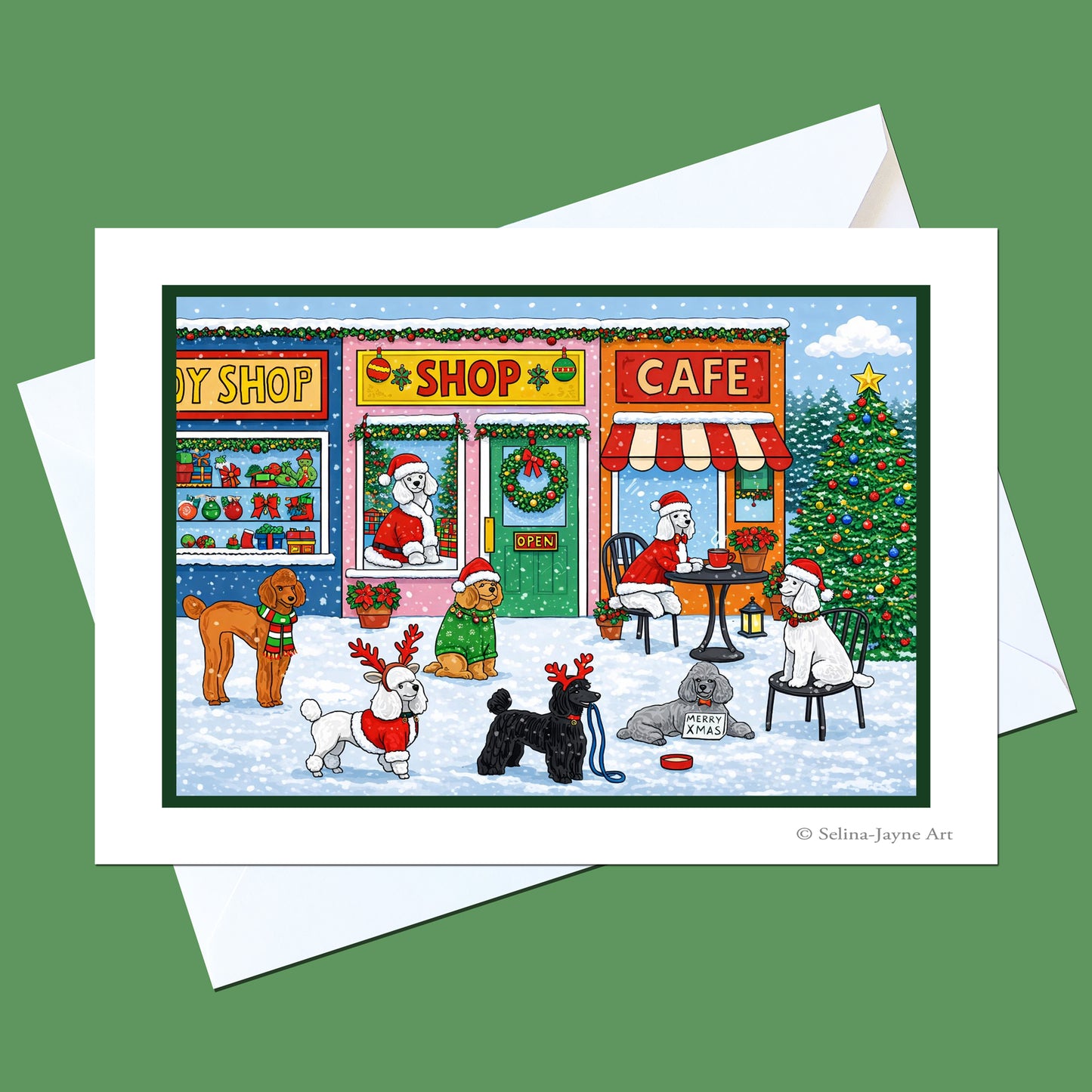 A Christmas-themed art print card featuring cartoon dogs in a snowy shop and cafe scene, shown with a white envelope on a solid green background.