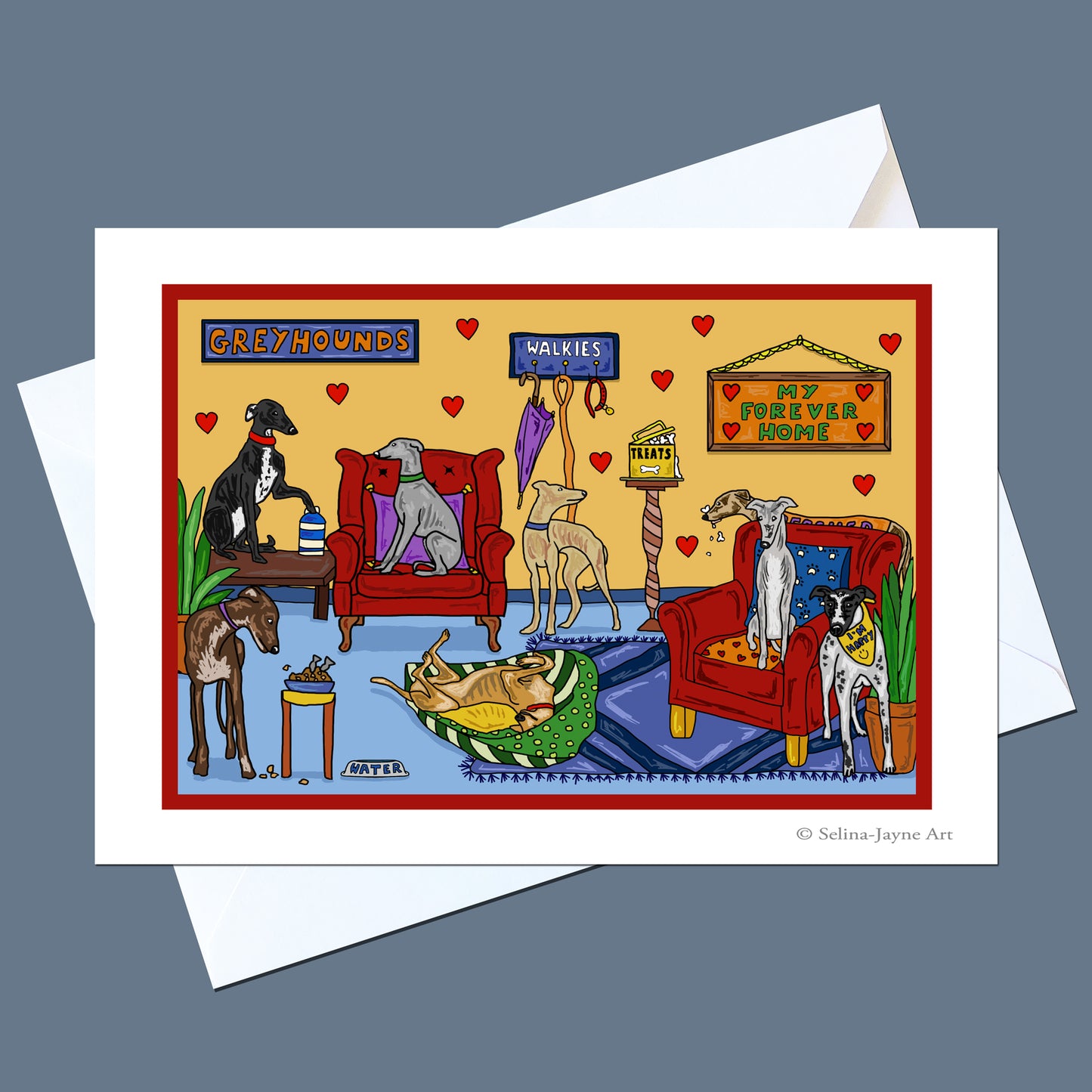 A greeting card featuring a colorful cartoon illustration of various greyhound dogs in a living room, displayed on top of white envelopes against a slate blue background.