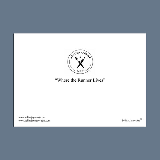 A minimalist white rectangular print or card centered on a muted blue-gray background. The card features the circular logo 'Selina Jayne Art' with crossed tools, the phrase 'Retired Greyhounds Forever Home' in quotation marks, website text along the bottom, and 'Selina Jayne Art' in the lower right.