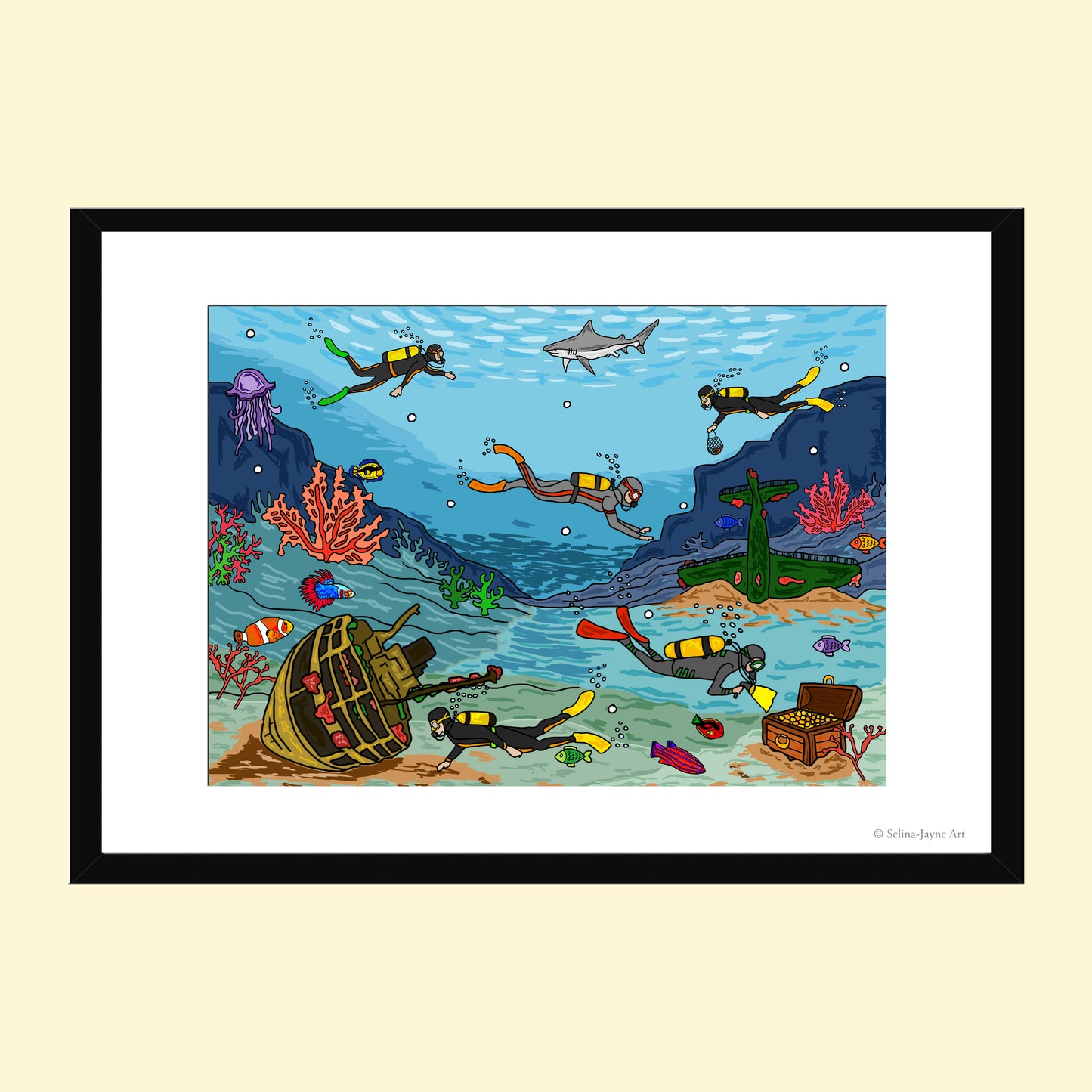 A framed art print featuring a colorful cartoon-style underwater scene with divers, a shark, coral, a sunken ship, and a treasure chest, shown against a light beige background.
