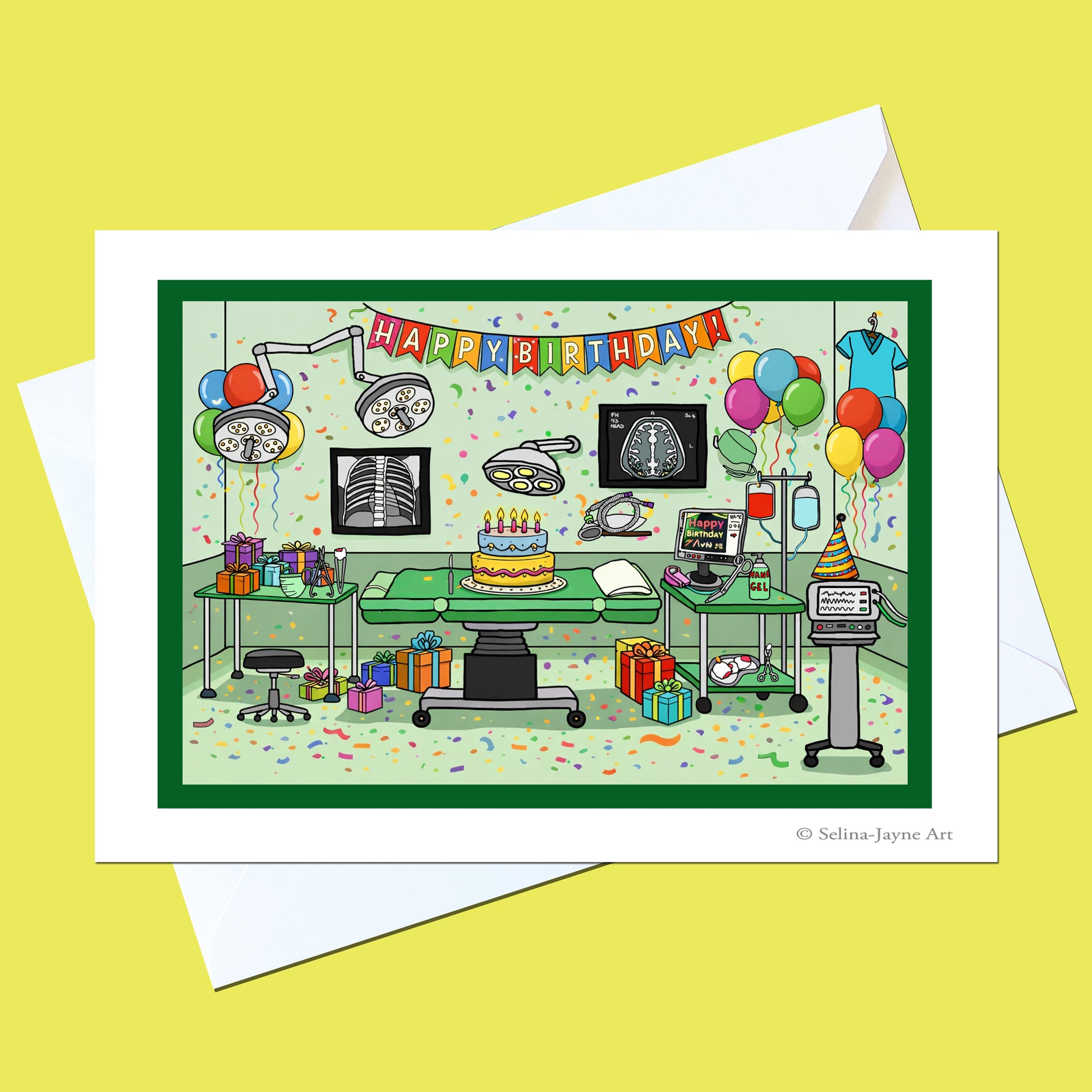A greeting card featuring a colorful cartoon illustration of a birthday surgery room with balloons, medical equipment, a cake, and confetti, shown with white envelopes on a yellow background.