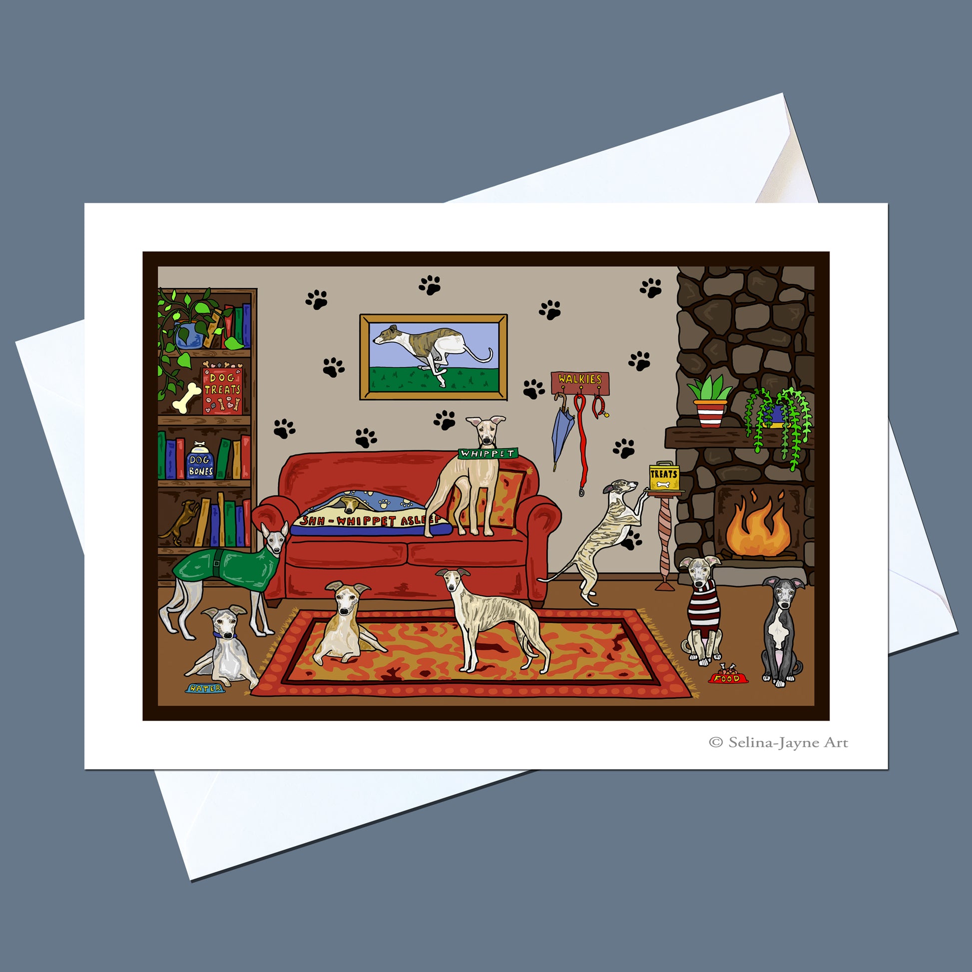 A square art print showing several dogs in a cozy living room, displayed on top of white envelopes against a slate blue background. The print features a red sofa, fireplace, bookshelf, and patterned rug with illustrated dogs throughout.