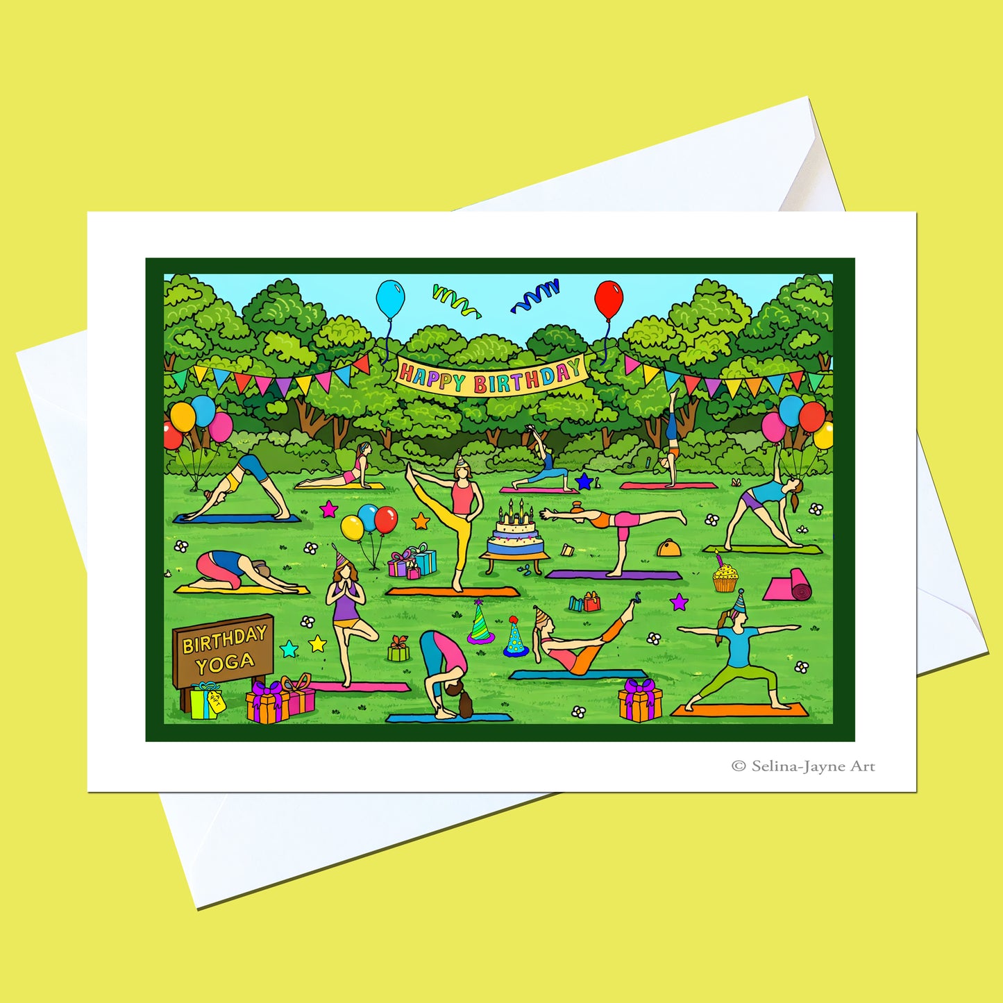 A square greeting card with a white border and white envelope, featuring a colorful cartoon illustration of people practicing yoga in a park with balloons, banners, and a 'Happy Birthday' sign, set against a pale yellow background.